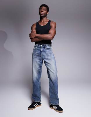 ASOS DESIGN – Niebieskie jeansy baggy z przebarwieniem w stylu vintage
