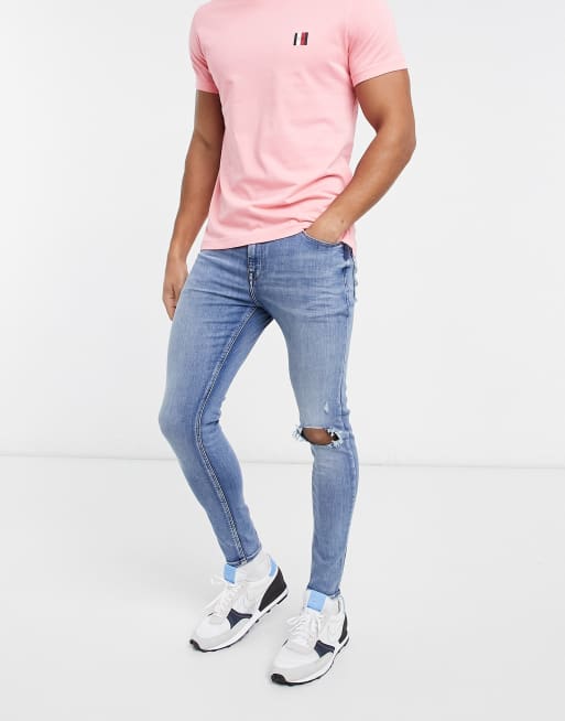 ASOS DESIGN – Niebieskie jeansy o bardzo obcisłym kroju z power stretchem i przetarciami na kolanach