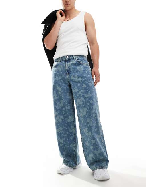 ASOS DESIGN – Niebieskie jeansy o bardzo obszernym fasonie z efektem sprania i wzorem w kwiaty