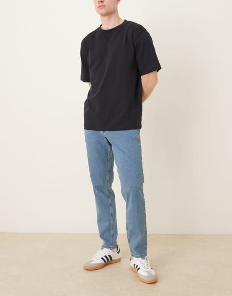 ASOS DESIGN - Niebieskie jeansy o fasonie ze zwężanymi nogawkami ze stretchem i efektem sprania - view 1