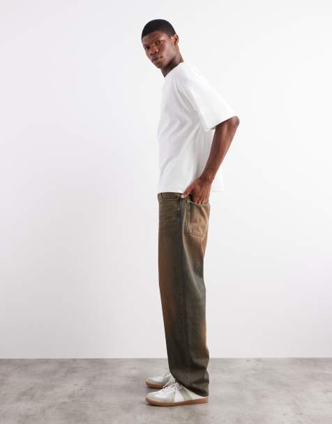 ASOS DESIGN baggy fit jeans in mid wash blue with brown tint