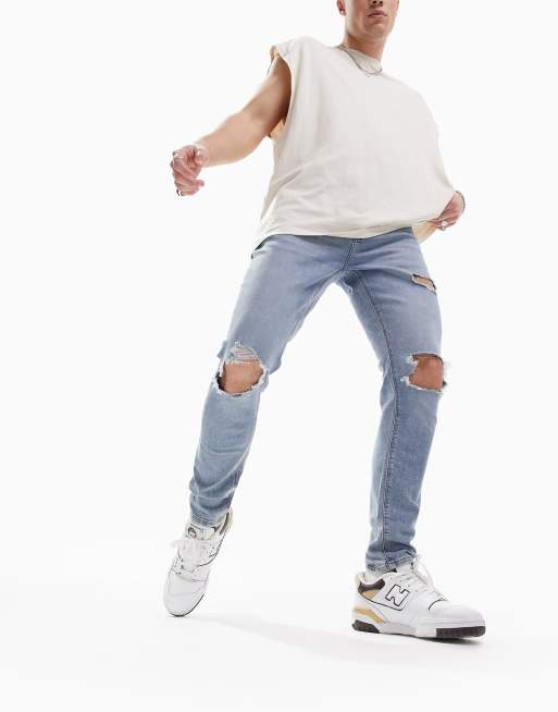ASOS DESIGN – Niebieskie jeansy o bardzo obcisłym kroju z power stretchem, efektem sprania i przetarciami na kolanach