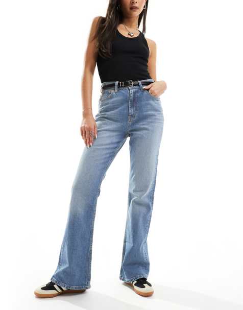 ASOS DESIGN mid rise flare jeans in mid blue