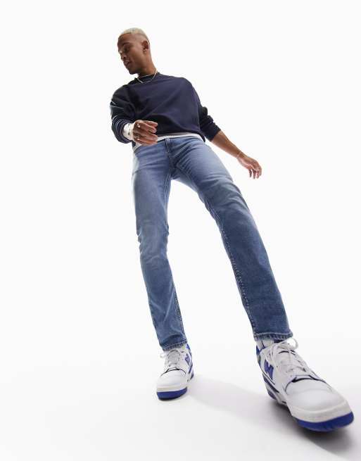 ASOS DESIGN - Niebieskie jeansy ze spranego denimu ze stretchem o obcisłym kroju