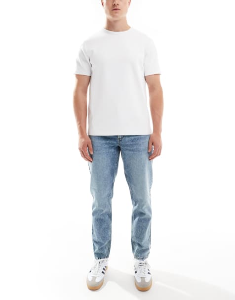 ASOS DESIGN tapered fit jeans in mid wash blue 