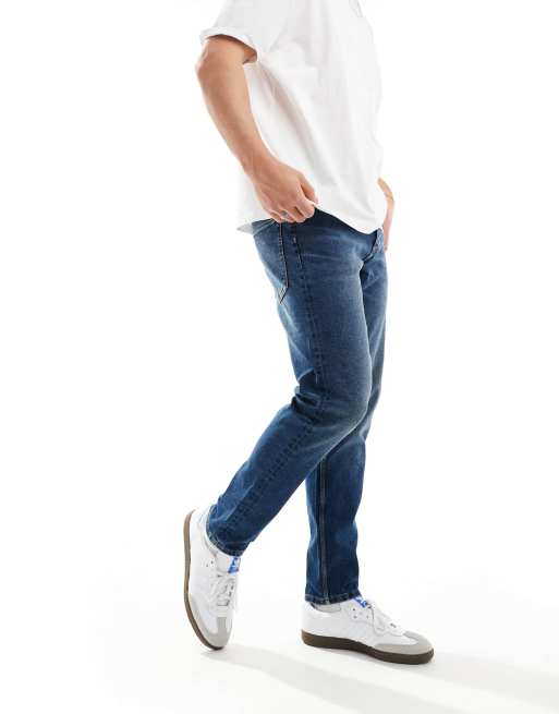 ASOS DESIGN – Niebieskie jeansy ze zwężanymi nogawkami