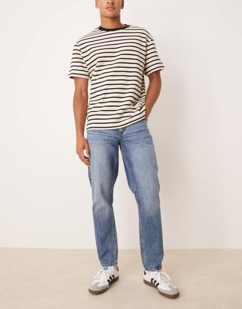 ASOS DESIGN tapered fit jeans in mid wash blue