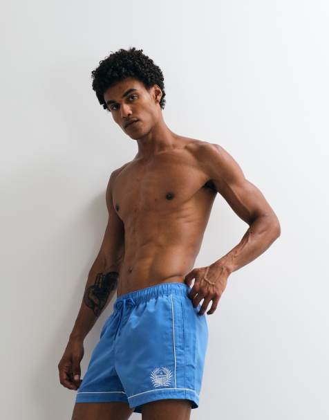 ASOS DESIGN – Niebieskie krótkie szorty kąpielowe z haftem - view 1