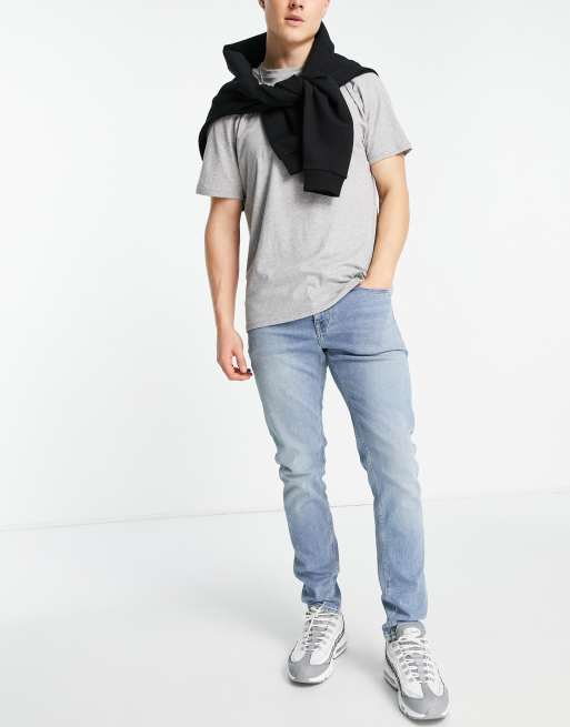 ASOS DESIGN – Niebieskie lekko sprane jeansy o obcisłym kroju