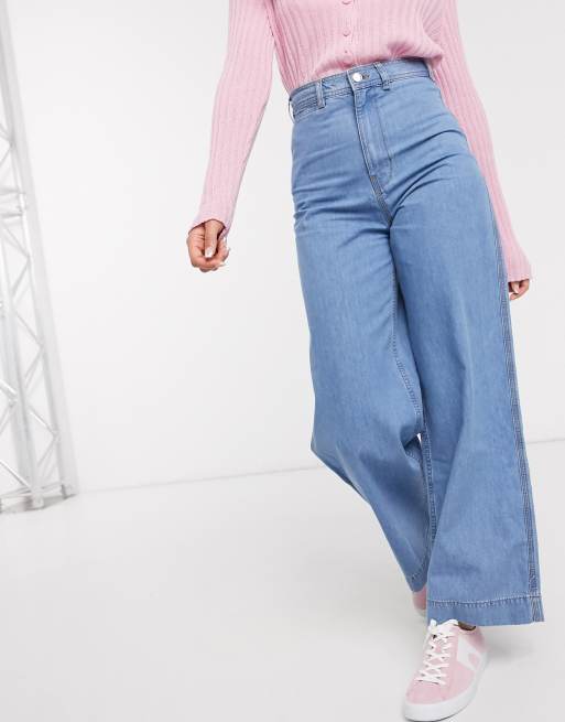 ASOS DESIGN – Niebieskie lekko sprane jeansy z szerokimi nogawkami