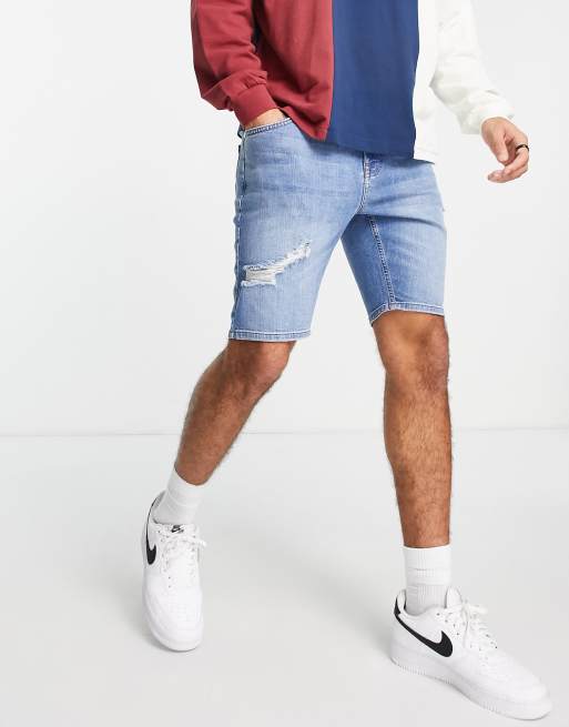 ASOS DESIGN – Niebieskie szorty jeansowe o obcisłym kroju i regularnej długości z przetarciami 