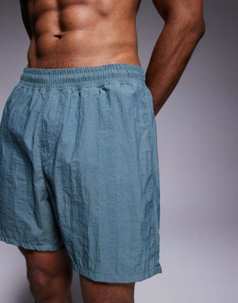 ASOS DESIGN swim shorts in mid length in blue