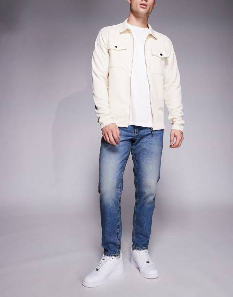 ASOS DESIGN tapered jeans in mid wash with tint