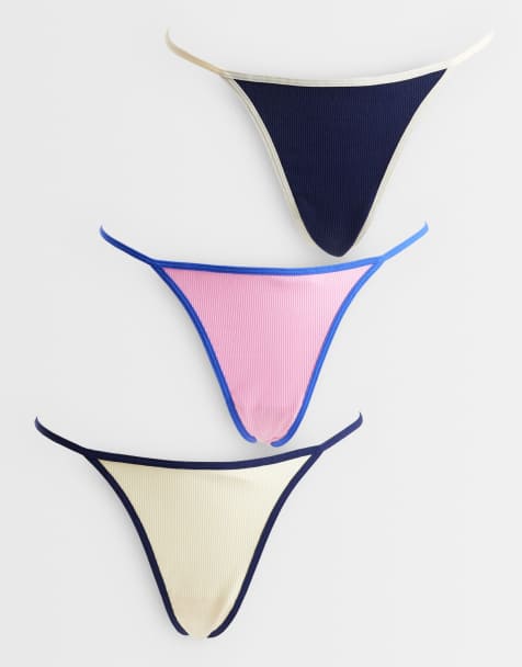 ASOS DESIGN Nora 3 pack ribbed tanga lingerie thong with contrast binding in navy, pink & buttermilk - view 1