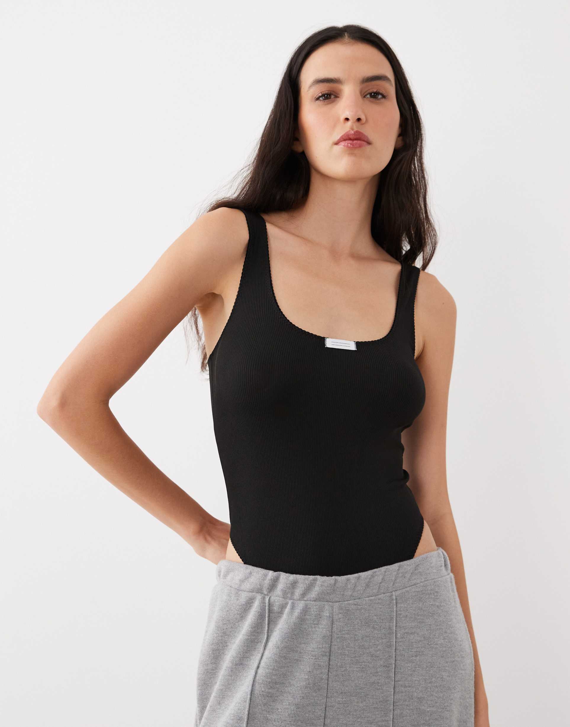 asos design nora ribbed soft bodysuit with tab detail in black