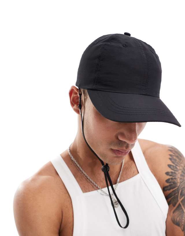 ASOS DESIGN - nylon cap with drawstring in black