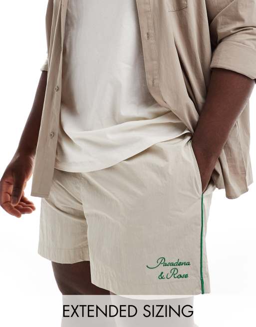 ASOS DESIGN - Nylon short in ecru met groene biezen 