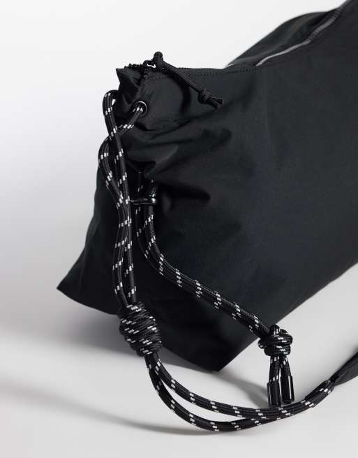 ASOS DESIGN nylon slouch sling crossbody bag in black, 3 of 4