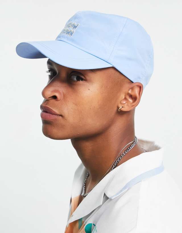 ASOS DESIGN nylon soft baseball cap in baby blue with slogan - LBLUE