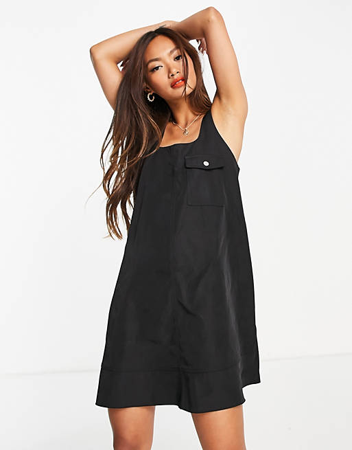 Dresses nylon swing mini pinny dress in black 