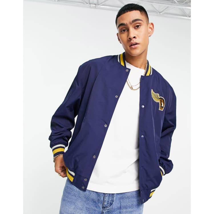 ASOS DESIGN nylon varsity jacket in navy and mustard