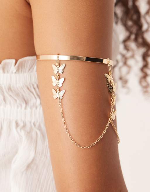 ASOS DESIGN – Oberarmreif in Goldoptik mit Kettendetails mit Schmetterlings-Anhängern, 3 von 3