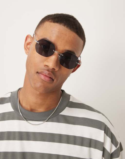 ASOS DESIGN - Occhiali da sole rotondi senza bordo con stanghette argento e lenti sfumate