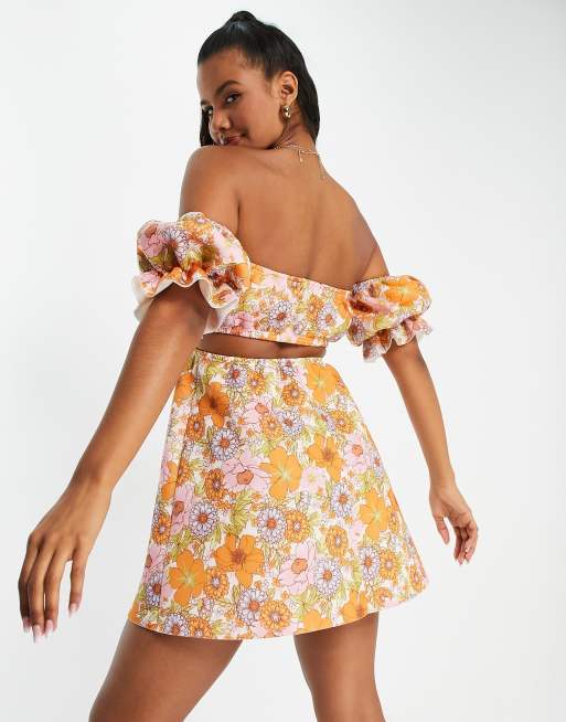 ASOS DESIGN off shoulder cut out mini skater dress in 70s floral print