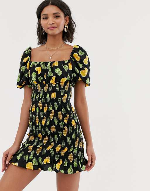 Off shoulder mini dress with shirring in lemon and lime print