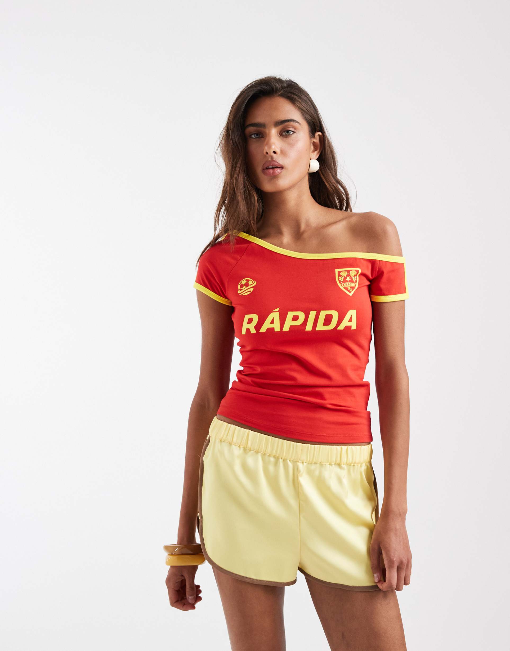asos design off the shoulder bardot tee with soccer graphic in yellow and red