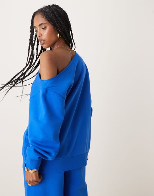 ASOS DESIGN off the shoulder brushback sweatshirt in blue