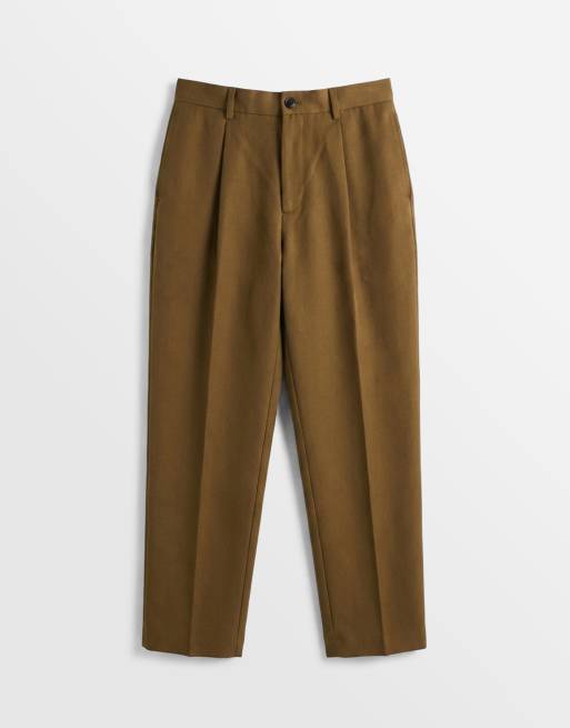 ASOS DESIGN – Olivgröna, figursydda, avsmalnande finbyxor i oversize med veck, 6 av 9