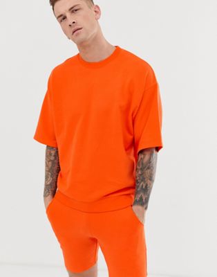 ASOS DESIGN – Orange kortärmad träningsoverall med shorts