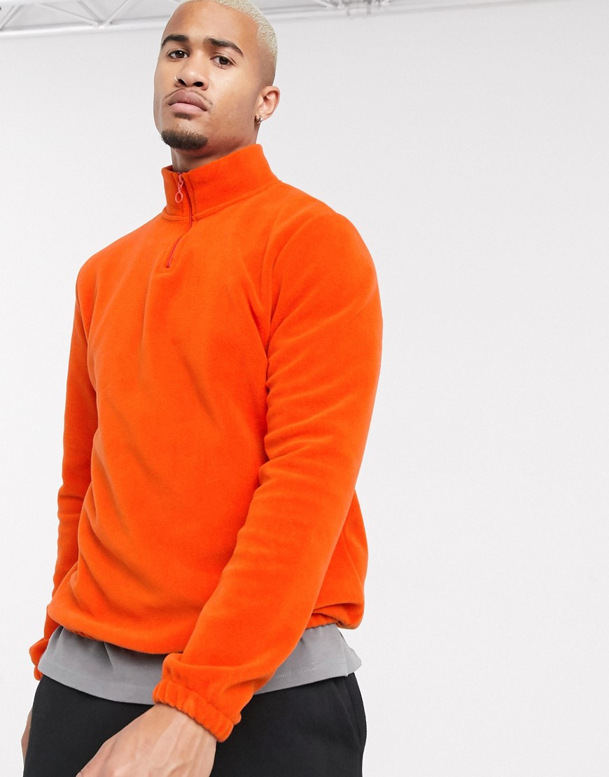 ASOS DESIGN – Orange sweatshirt i fleece med halvlång dragkedja