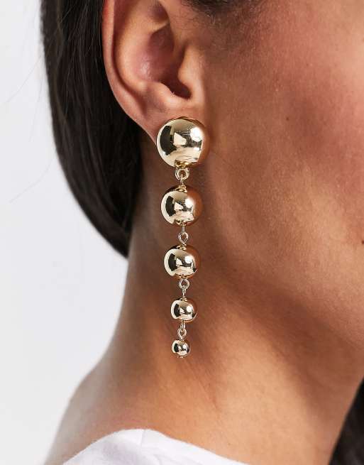 ASOS DESIGN - Orecchini pendenti color oro con sfere di dimensioni decrescenti