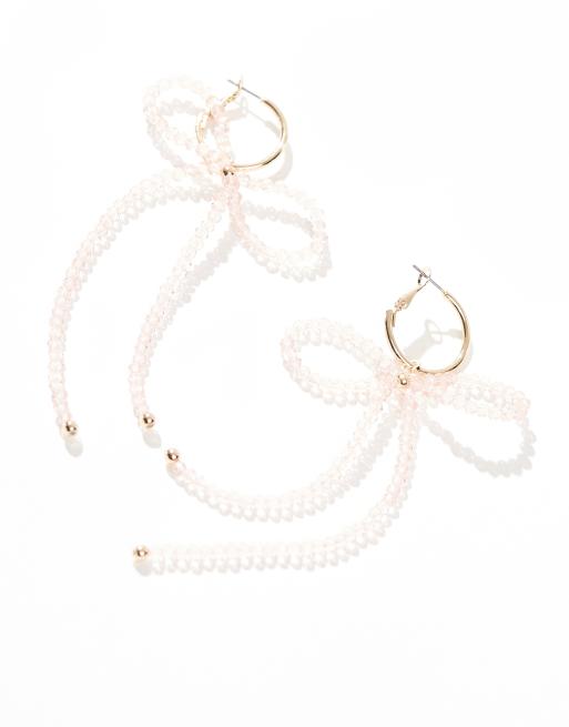 ASOS DESIGN - Orecchini pendenti dorati con perline rosa e design a forma di fiocco, 2 di 4