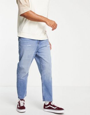 ASOS DESIGN relaxed tapered jeans in vintage mid wash