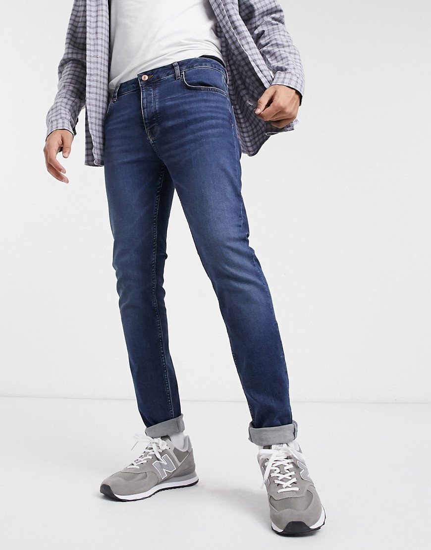 ASOS DESIGN Organic cotton blend skinny jeans in dark wash blue