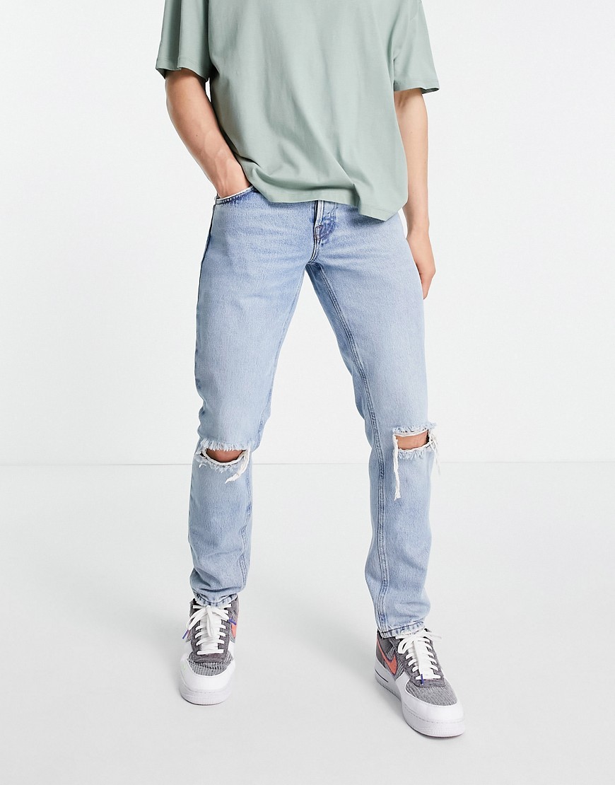 ASOS DESIGN Organic cotton blend slim jeans in 90s stone wash with knee rips-Blues