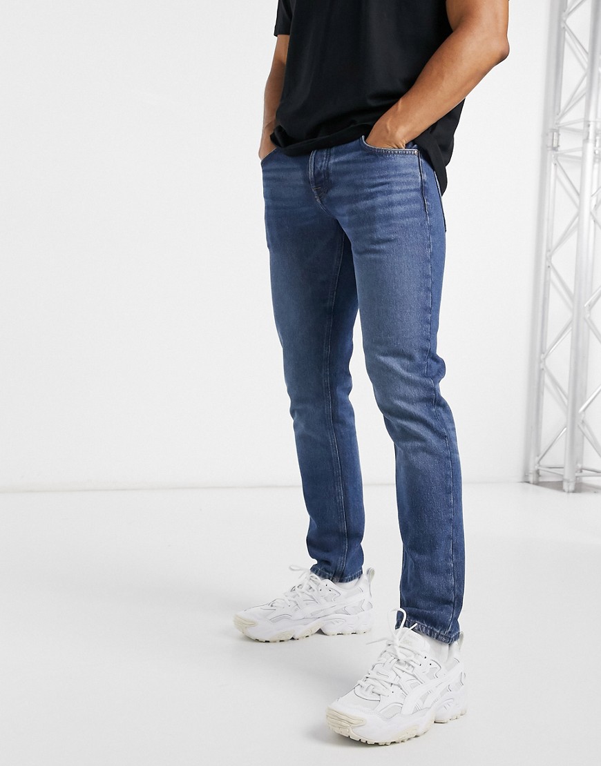 ASOS DESIGN Organic cotton blend slim jeans in dark wash blue