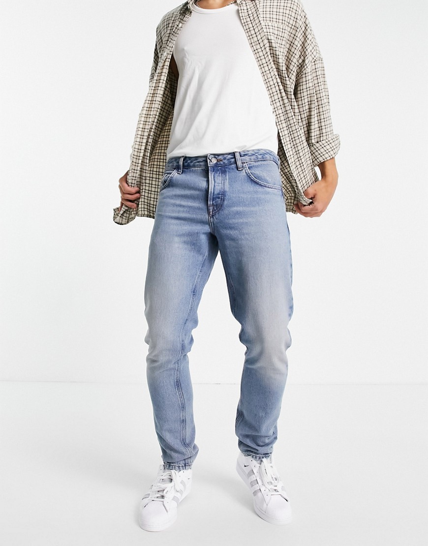 ASOS DESIGN Organic cotton blend slim jeans in tinted light wash-Blues