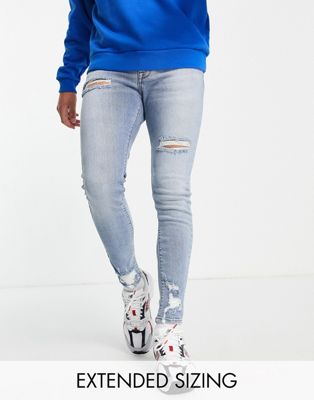 ASOS DESIGN spray on jeans with power stretch in mid wash