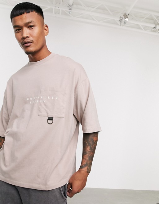 ASOS Unrvlld Supply organic cotton oversized t-shirt with pocket detail and Unrvlld Supply logo