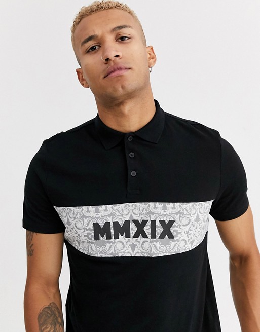 ASOS DESIGN organic cotton polo with colour block paisley panels and roman numeral print