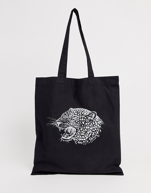ASOS DESIGN organic cotton tote bag in black with leopard head print