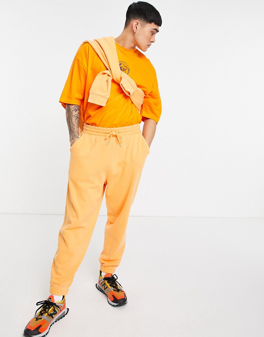 ASOS DESIGN organic matching oversized sweatpants in orange vintage wash