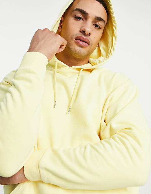 ASOS DESIGN organic oversized hoodie in neon yellow vintage wash