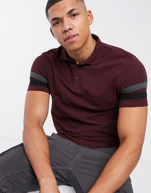 ASOS DESIGN organic skinny polo shirt with contrast sleeve stripes