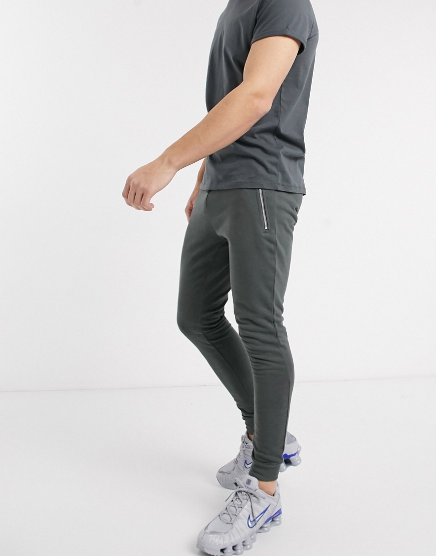 ASOS DESIGN organic super skinny sweatpants in washed black with silver zip pockets-Gray