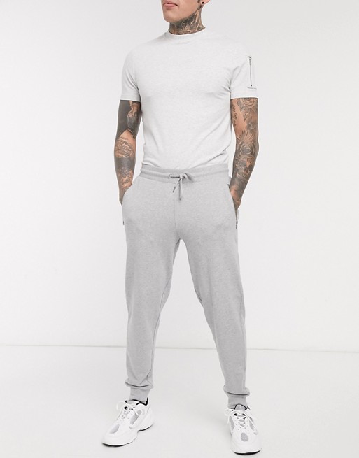 ASOS DESIGN organic tapered joggers in grey marl with silver zip pockets